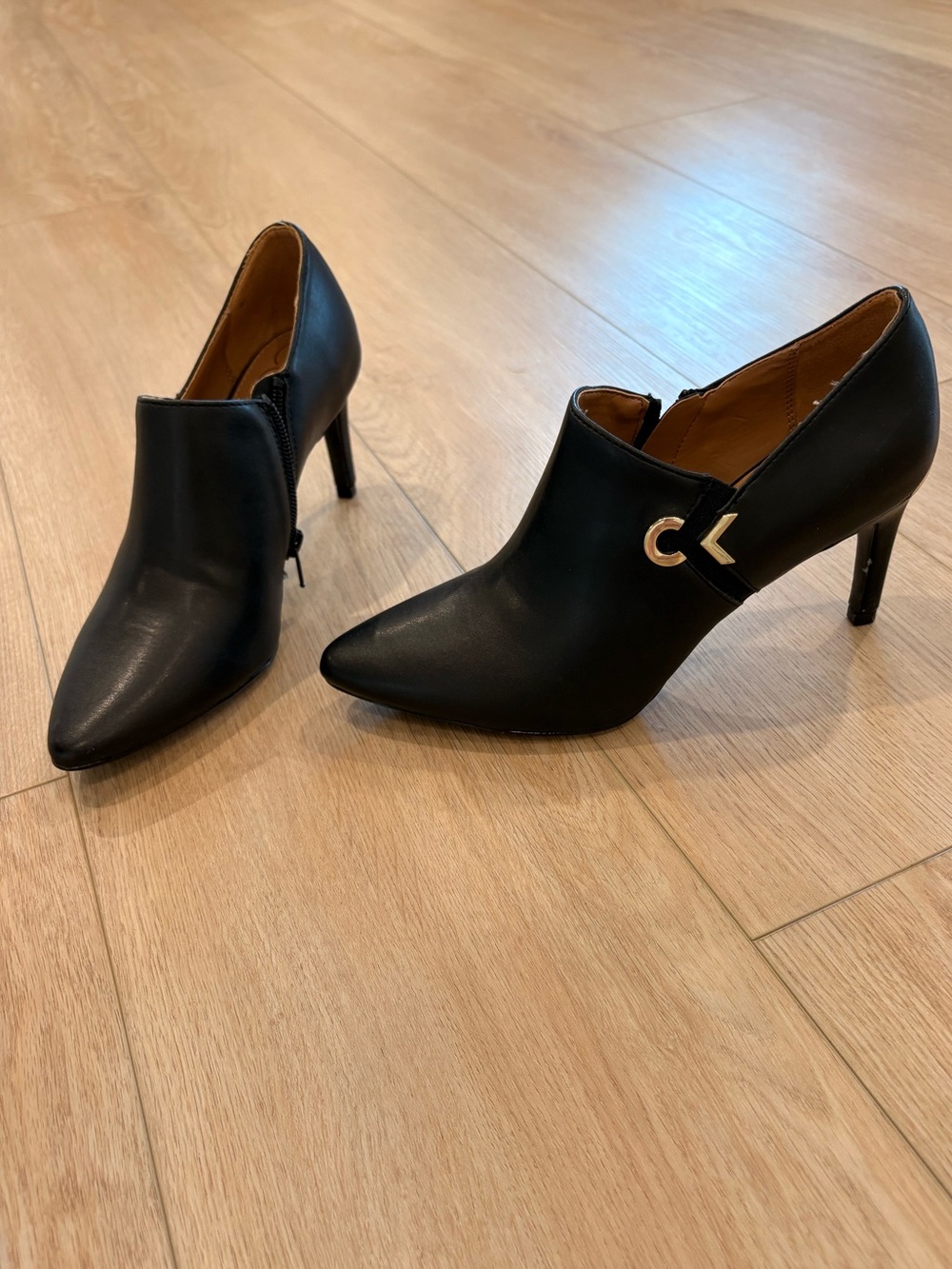 Calvin Klein Black Pointed Toe High Heel Booties with Gold Accent
